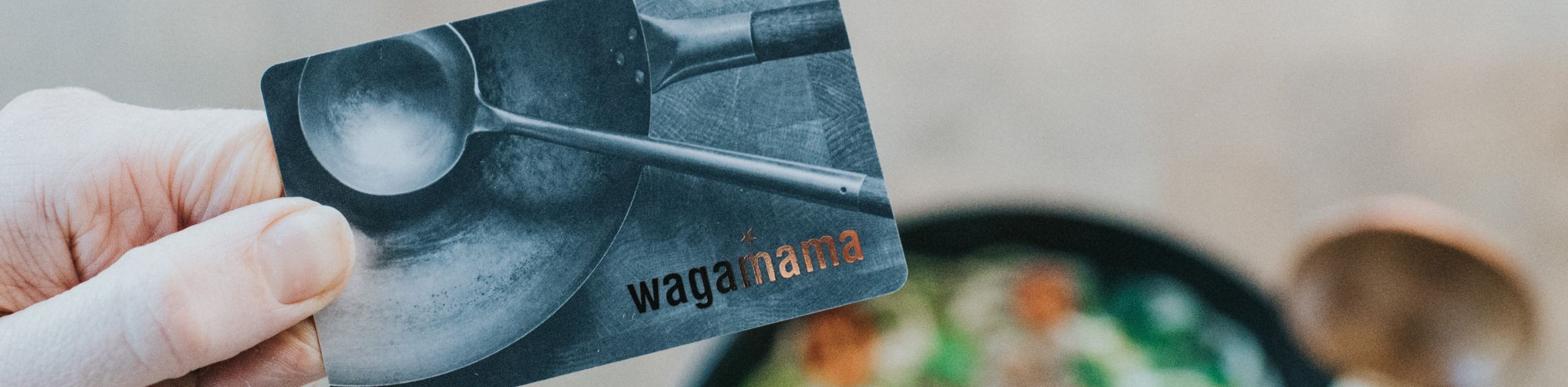 holding wagamama gift card